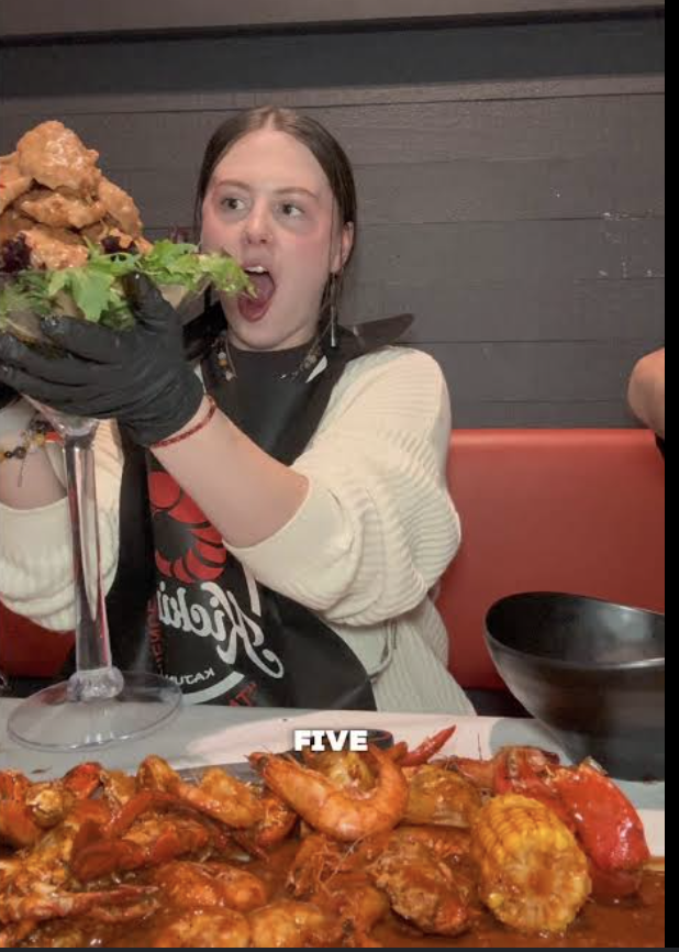 Customer enjoying Crabby Mama's seafood boil