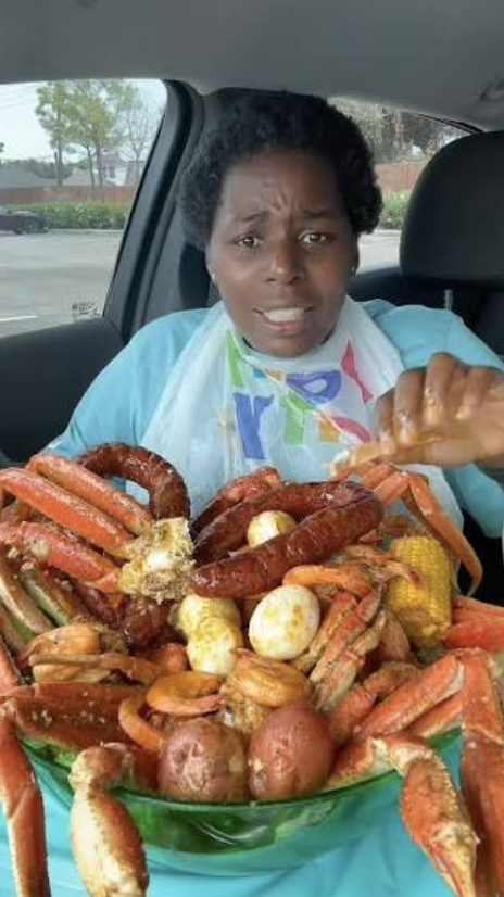 Customer enjoying Crabby Mama's seafood boil
